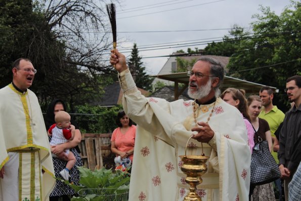 Fr. Paul Albert blessing the garden