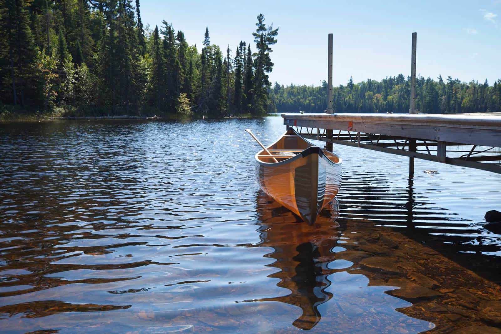 Backlit Canoe Tied to a Dock on a Northern Minnesota Lake